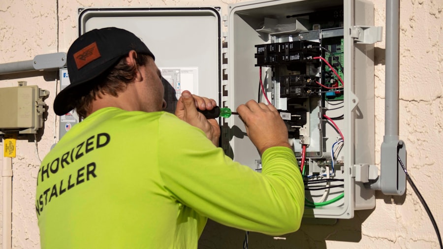Electrician installing an electrical panel